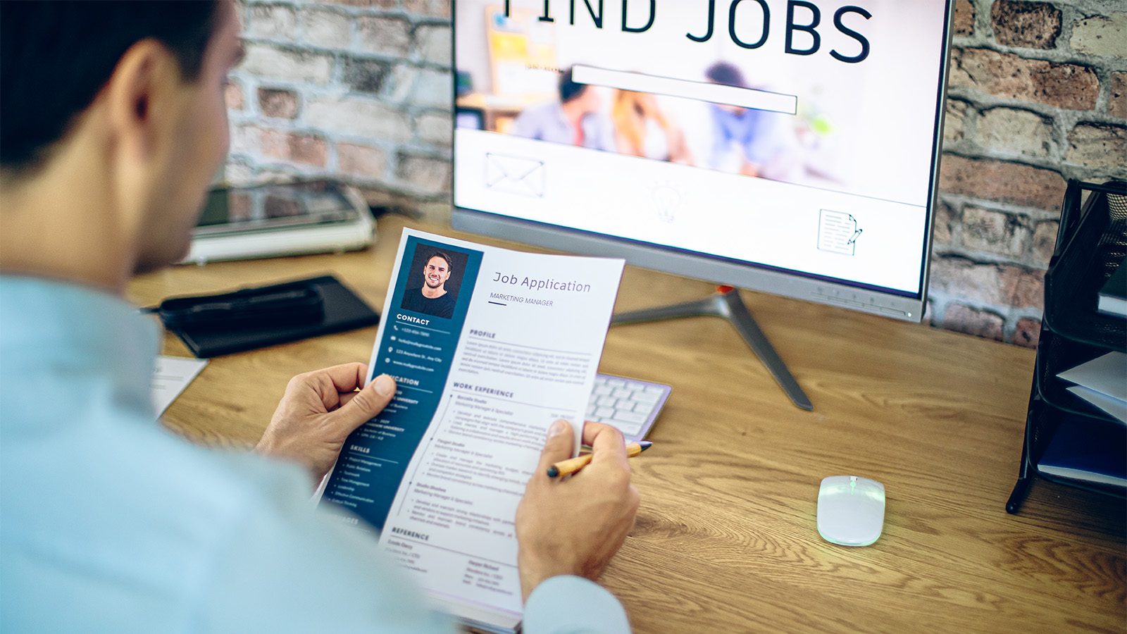 Man reviewing resume for an online job search 