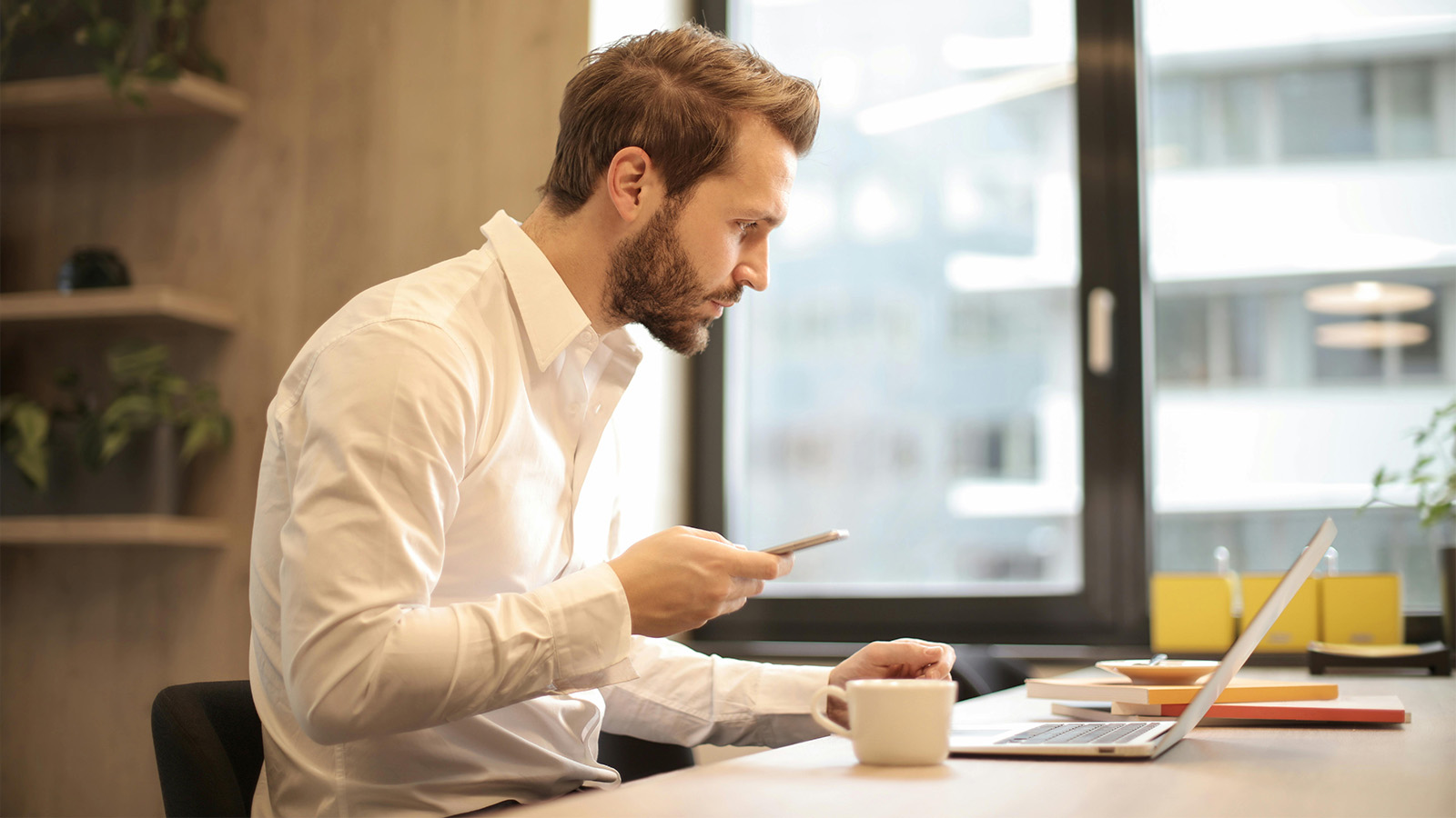 Professional man using 2-factor authentication to protect his account