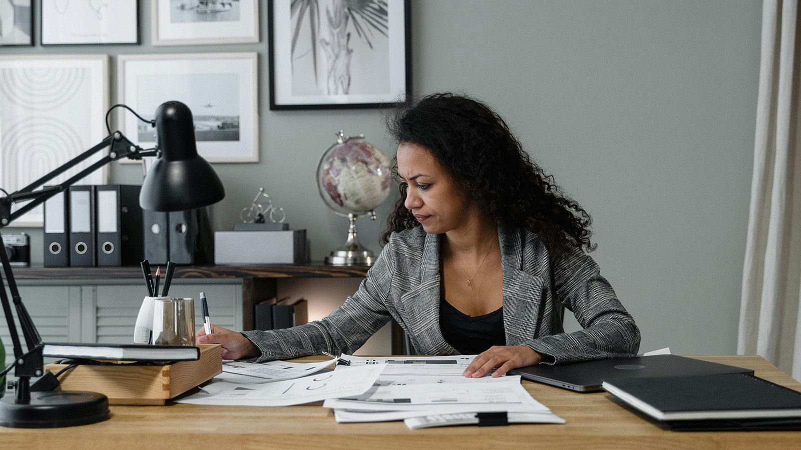 Woman at her desk working on papers