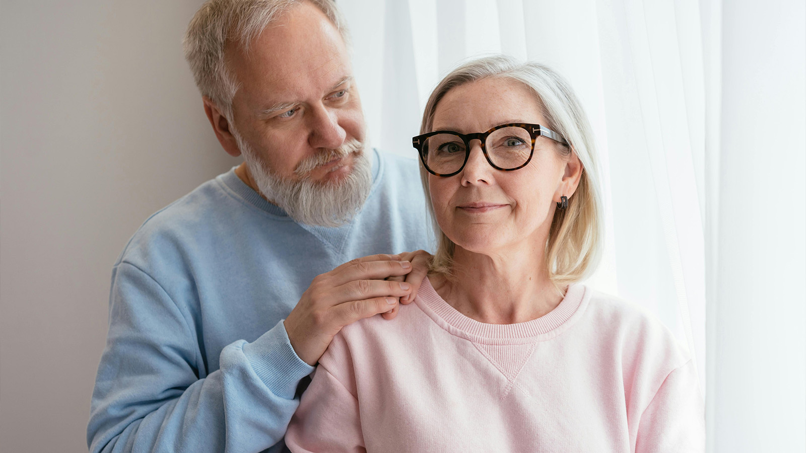 Middle aged couple looking casual in sweatshirts 