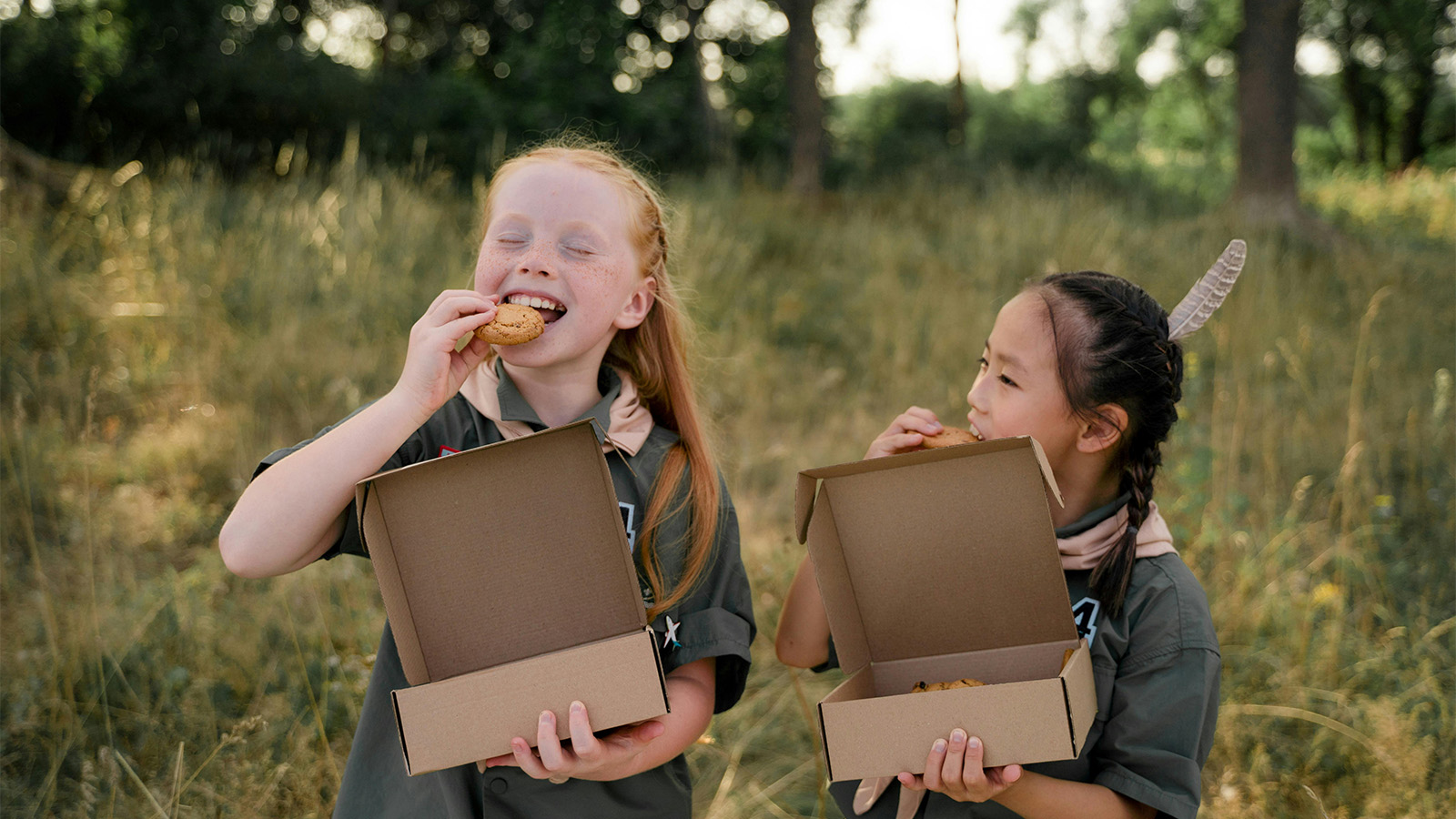 Two girls snacking on cookies