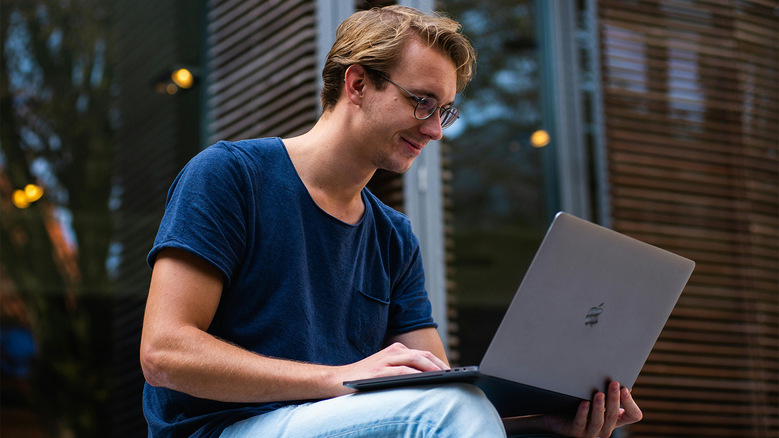 Young professional man on a Mac Book.