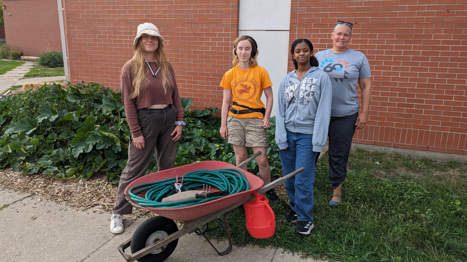 Students and mentors gardening