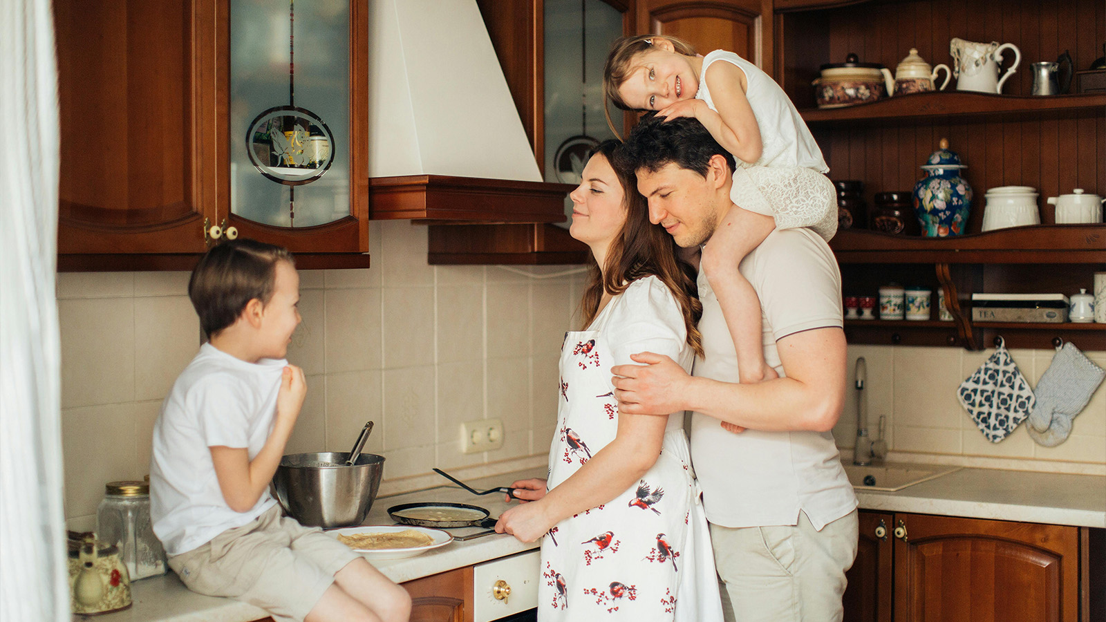 Family preparing a homemade breakfast in the kitchen