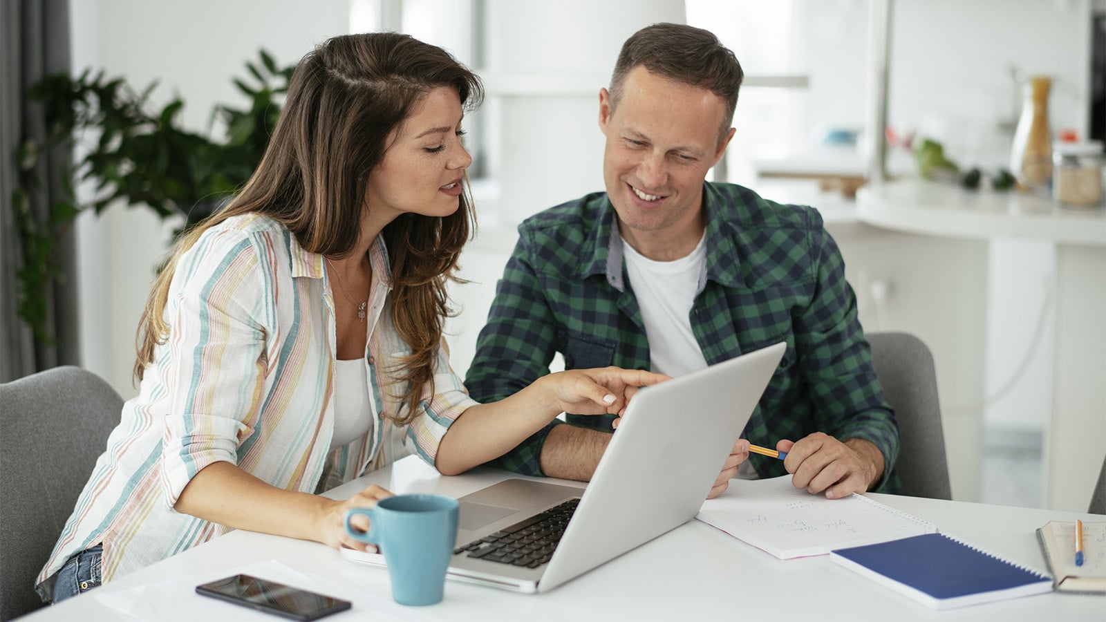 Happy couple planning their finances