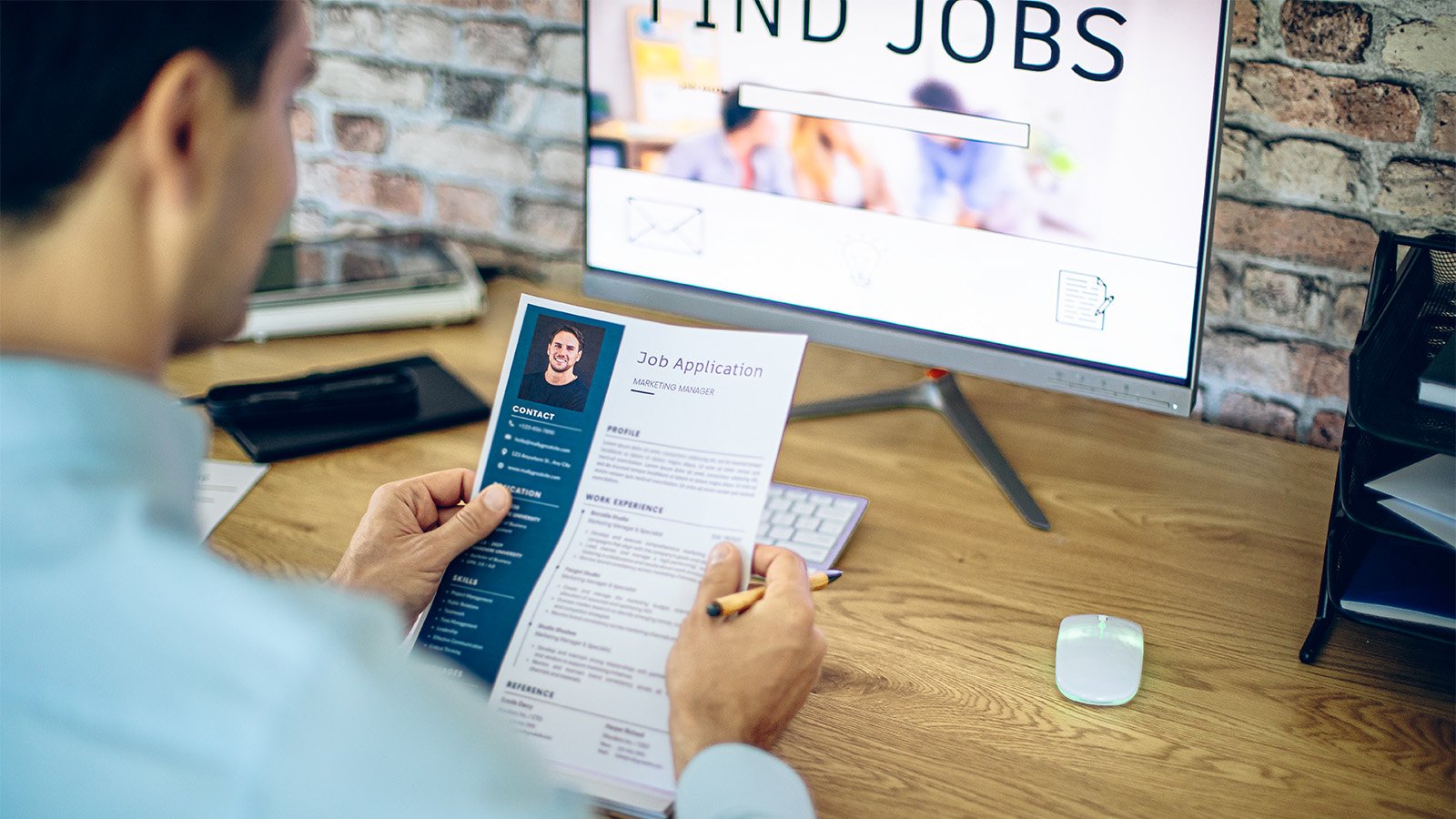 Man reviewing resume for an online job search 