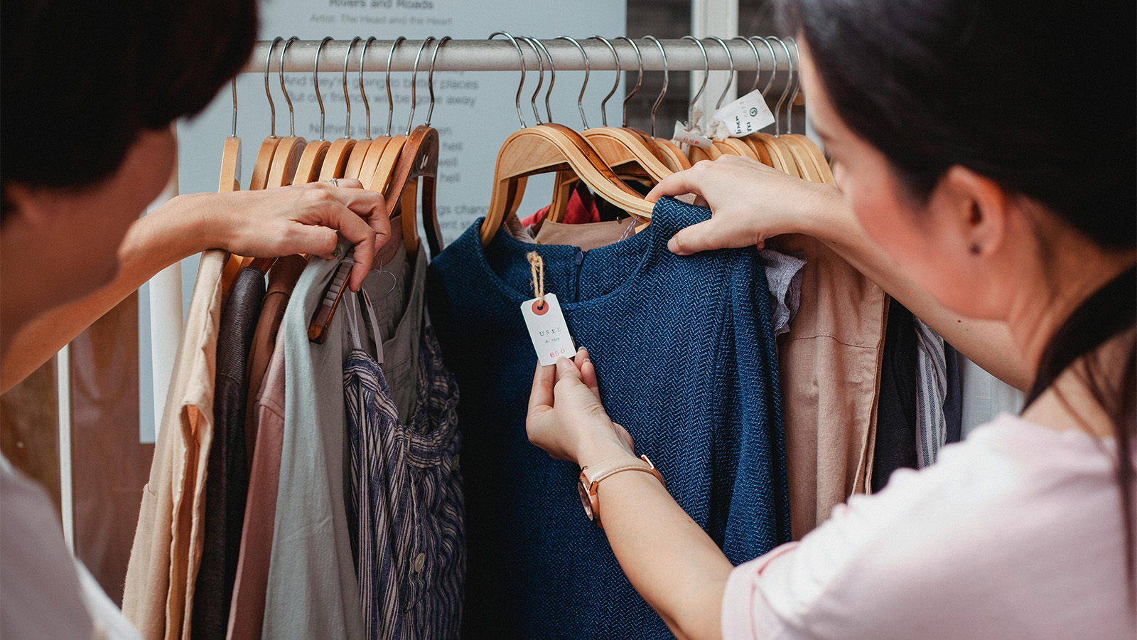 Savvy shoppers checking price tags in a store 